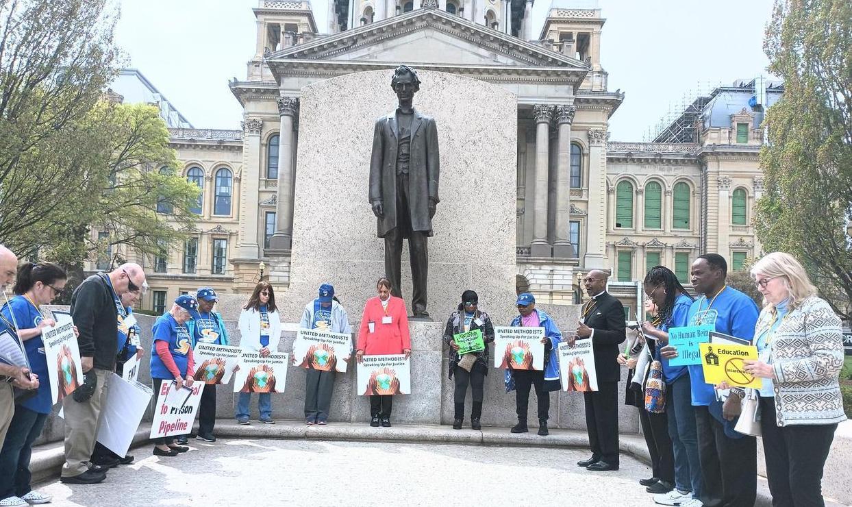 Praying In Front Of The Lincoln Statue