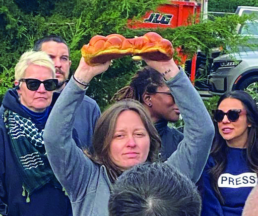 Abby Holcome Break Bread At Protest Cmyk