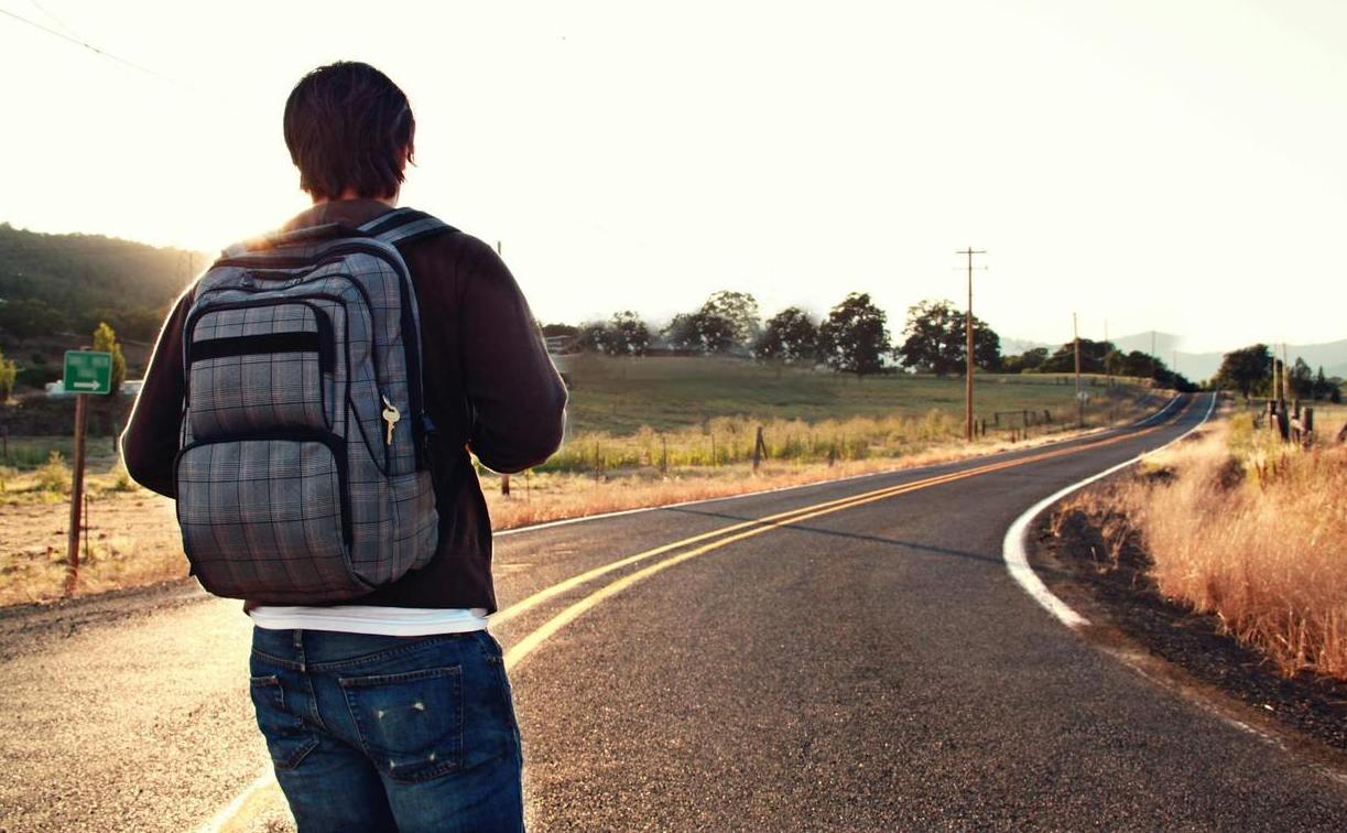 Hiker Headed Down Road