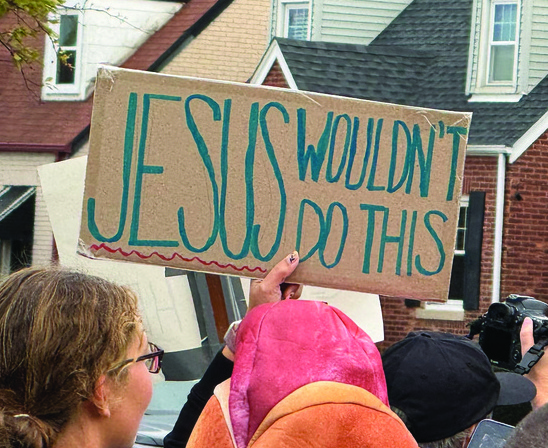 Jesus Wouldnt Do This Sign At Protest Cmyk