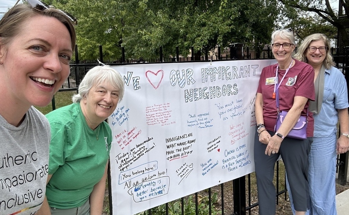 Team By Banner At Renewed Hope